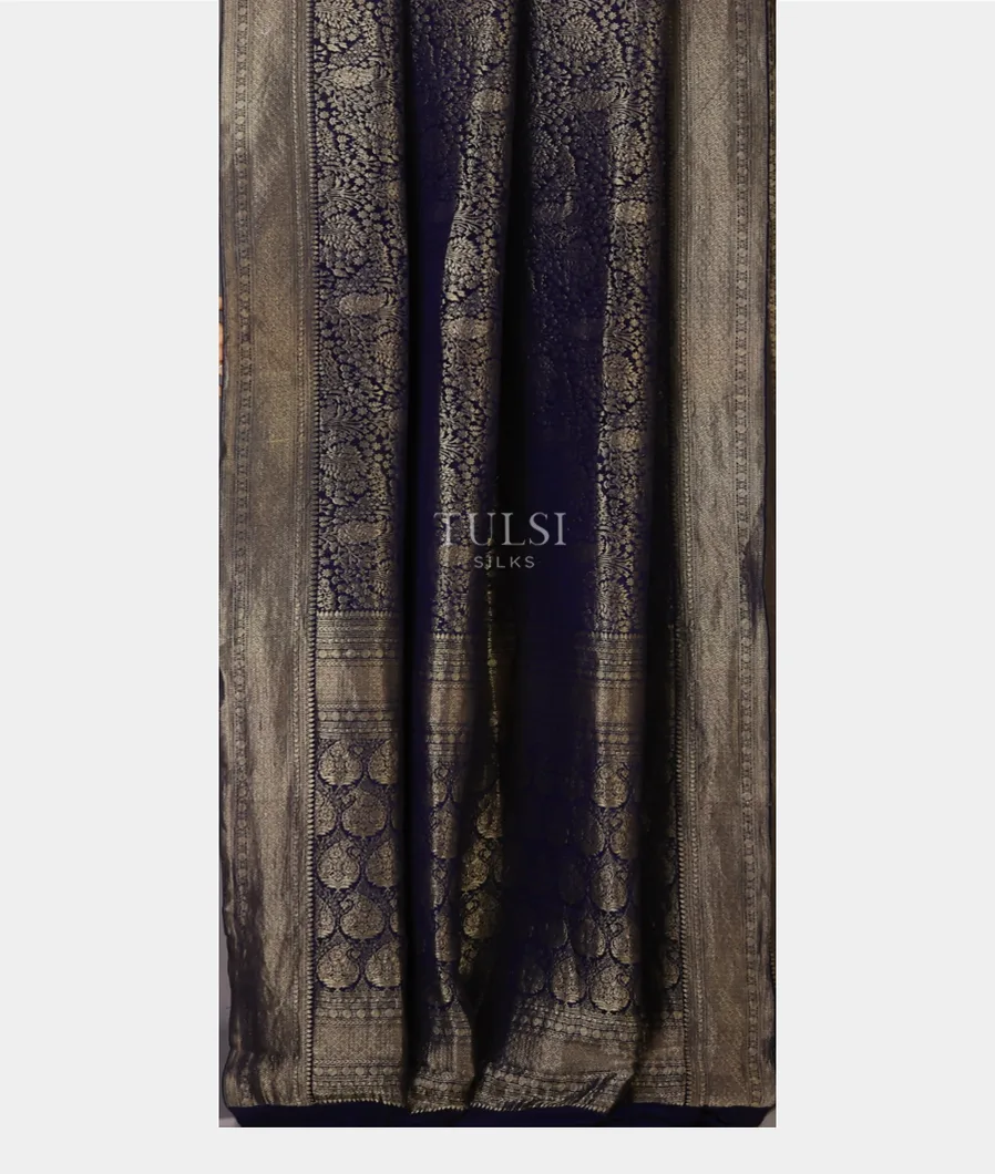 blue-georgette-silk-saree-is-embelished-with-gold-zari-design-throughout-the-body-with-a-self-blouse-t715849-t715849-b