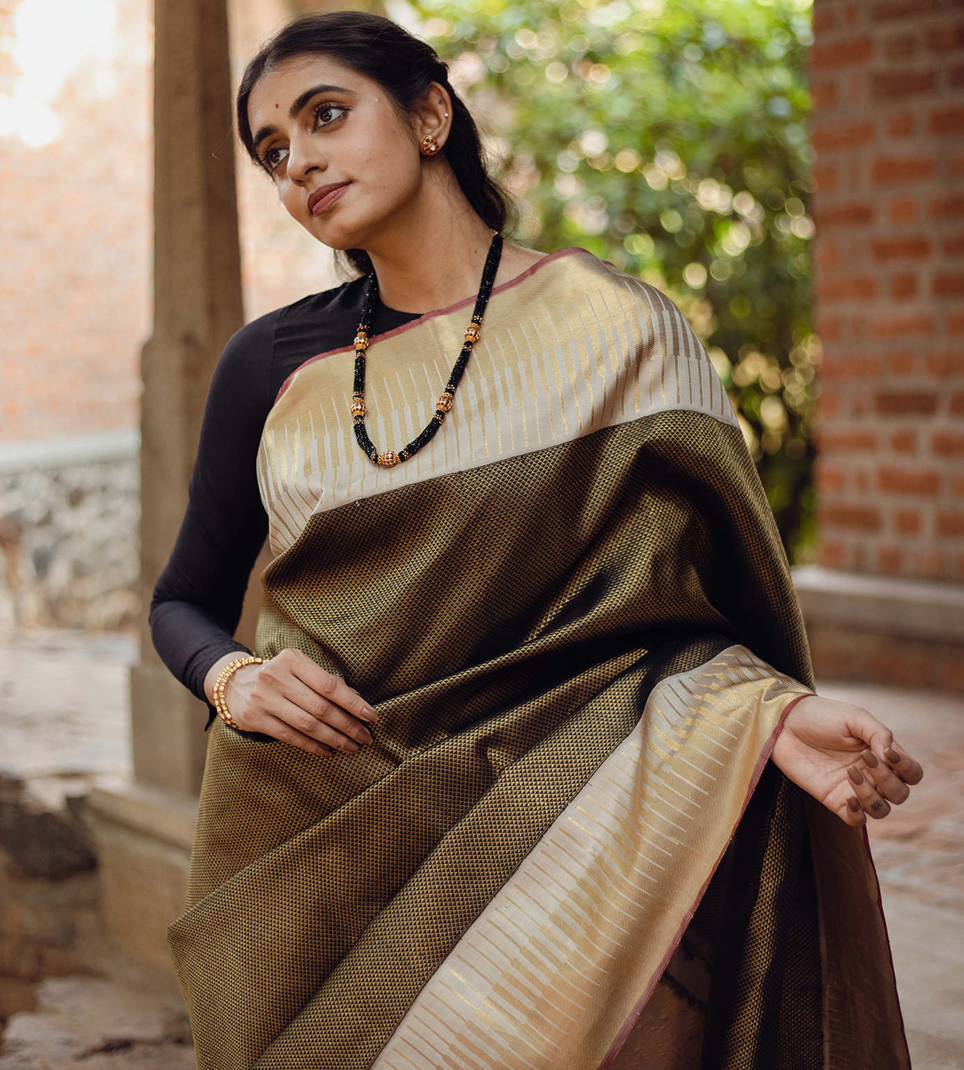 Nalli - This exquisite black Kanchipuram silk saree complemented by  contrast red border and pallu looks absolutely gorgeous. Shop Now at  https://bit.ly/blackkanchipuram63834 . . . . . #Nalli #nallisilk #saree # sarees #kanchipuram #