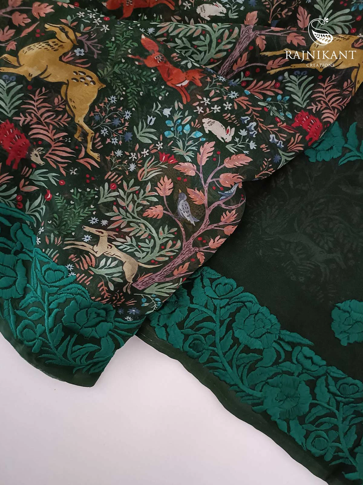 shikargah-x-parsi-styled-borders-on-a-bottle-green-georgette-saree-rka6983-2-a