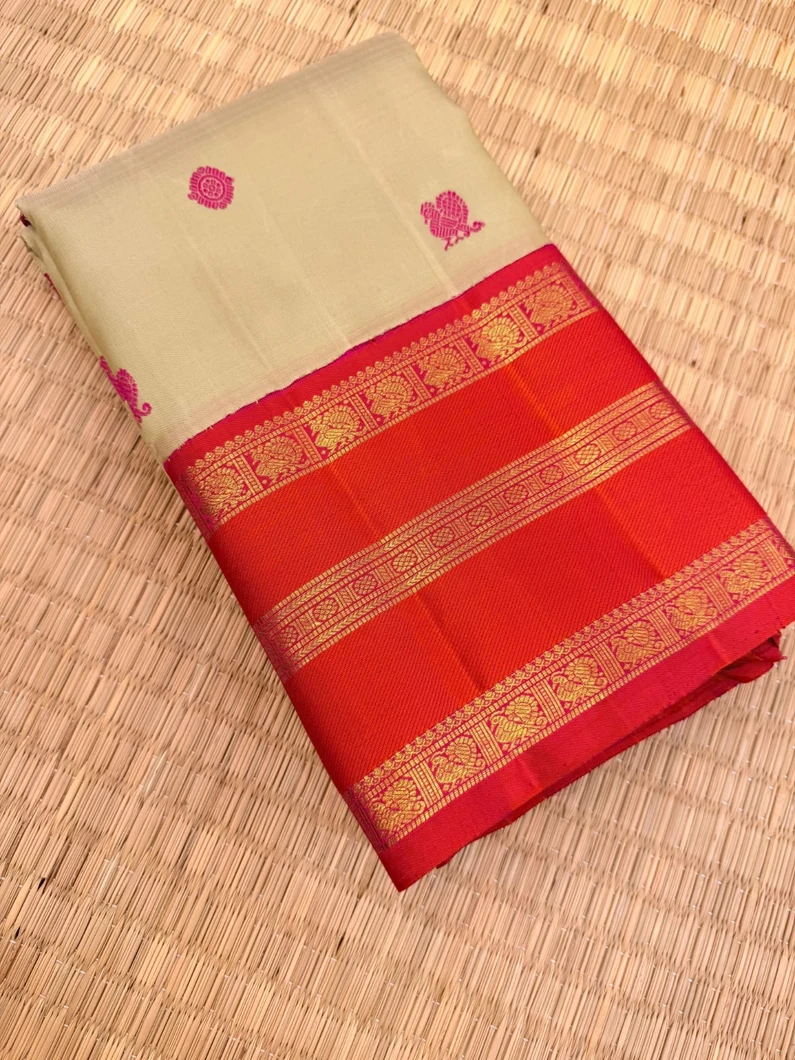 pure-kanchi-silk-saree-in-pista-green-with-orange-varisai-pettu-border-thread-buttas-sw000001841-a